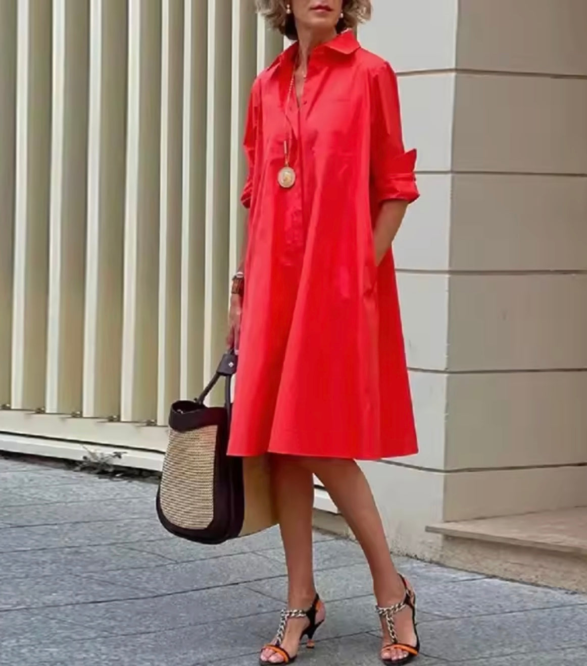 Women's collared A-line shirt dress with three-quarter sleeves and side pockets