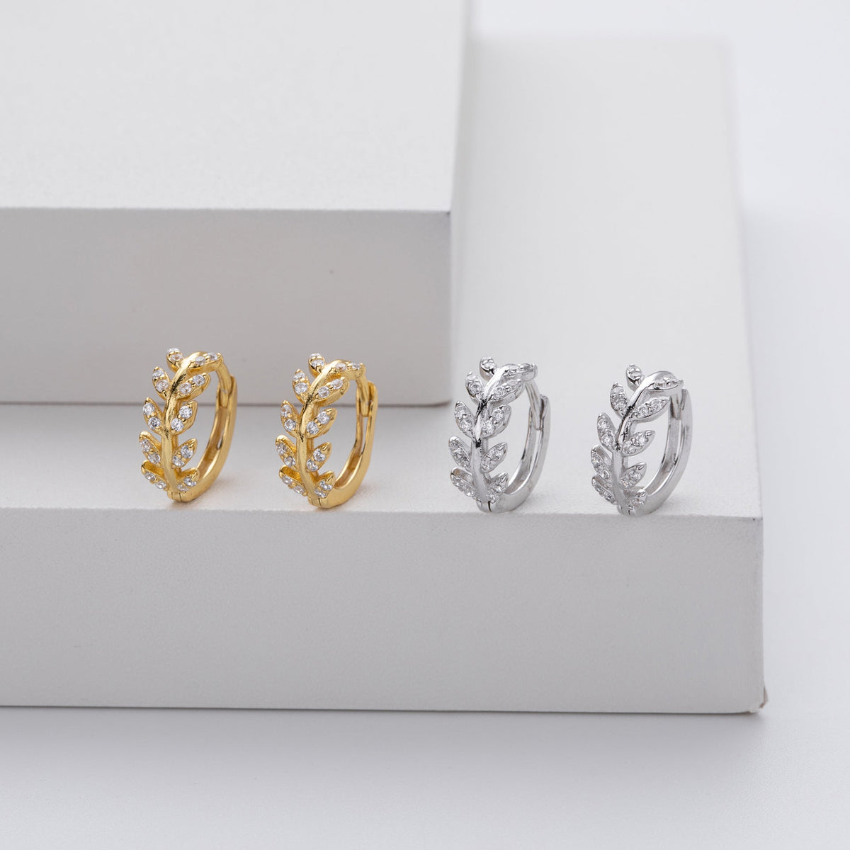 Kessoro women's two tone silver and gold leaf earrings shown in silver and gold finishes