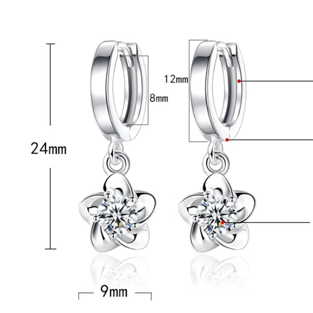Kessoro women's round white zircon earrings shown in violet and silver tone finishes