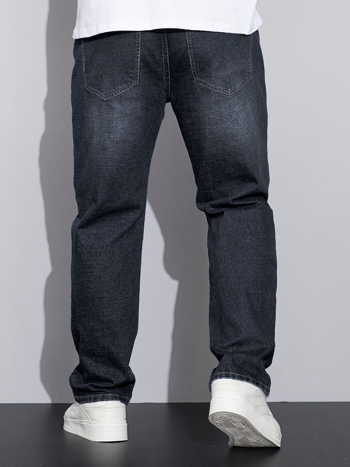 Men's mid-rise straight-leg stretch jeans in blue and black denim, colour option 2 back view