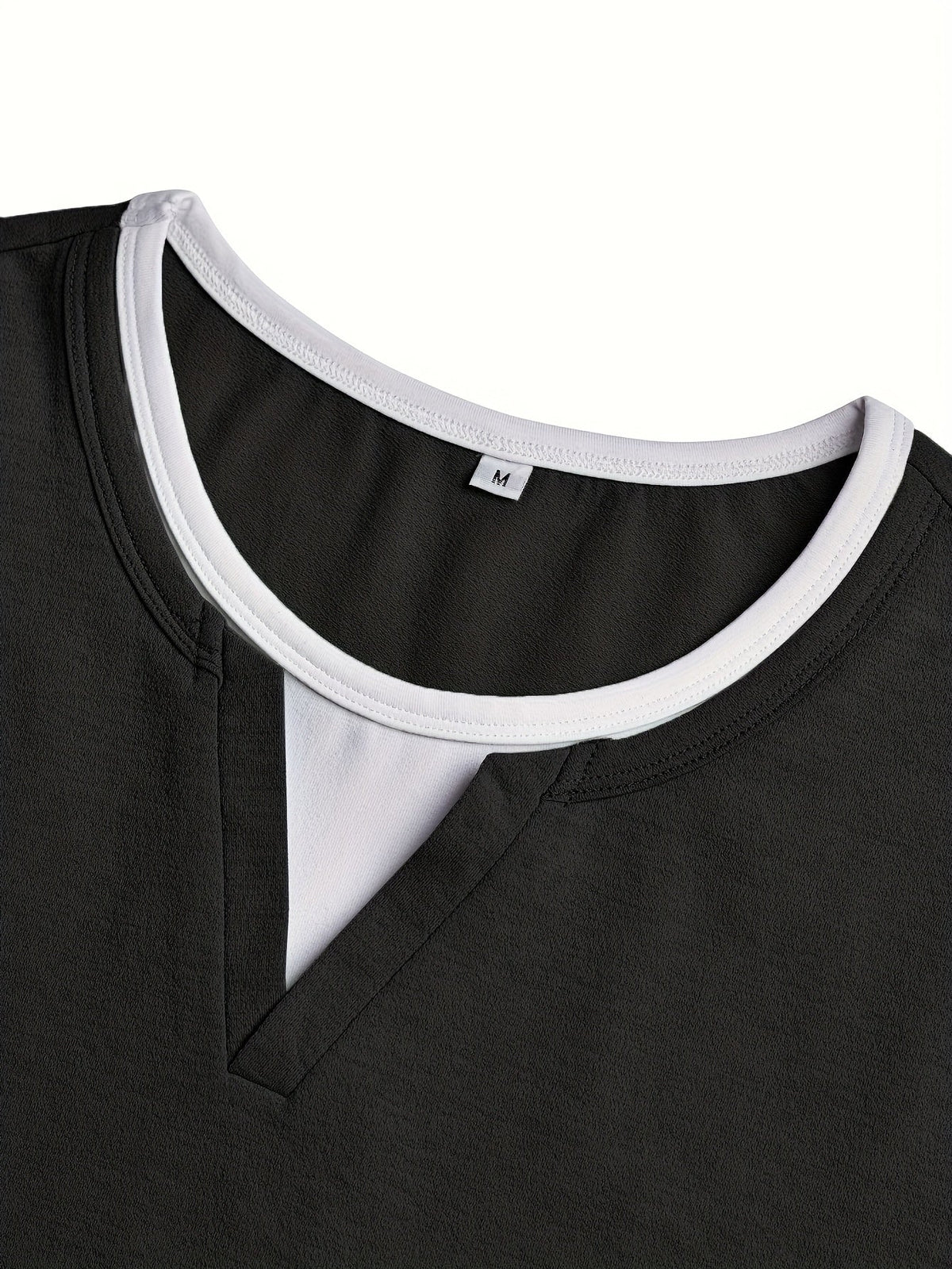 Men's notch-neck contrast-stitch henley shirt in black, close-up view