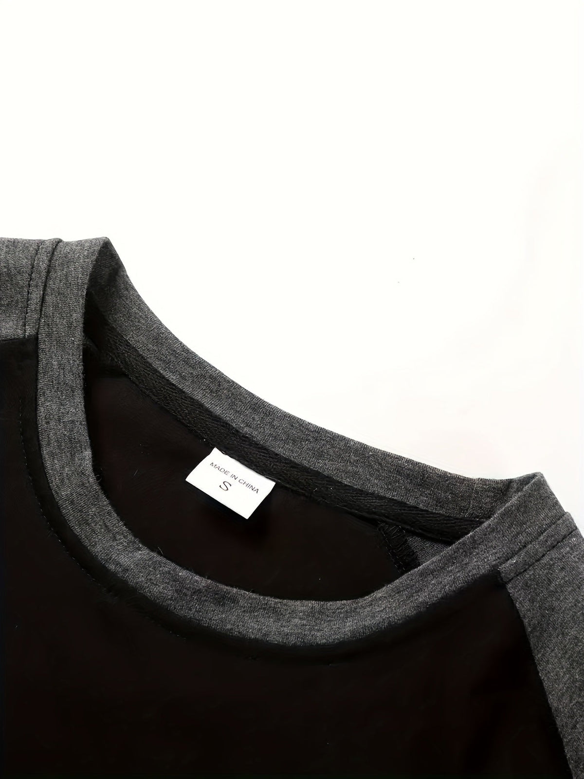 Men's two-tone raglan long-sleeve t-shirt in black, light grey and white, styled view