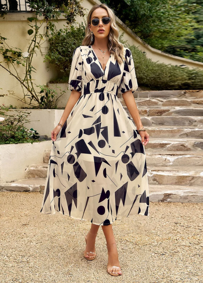 Women's floral print midi dress with a smocked waist and flowing skirt in bright multicolour shades