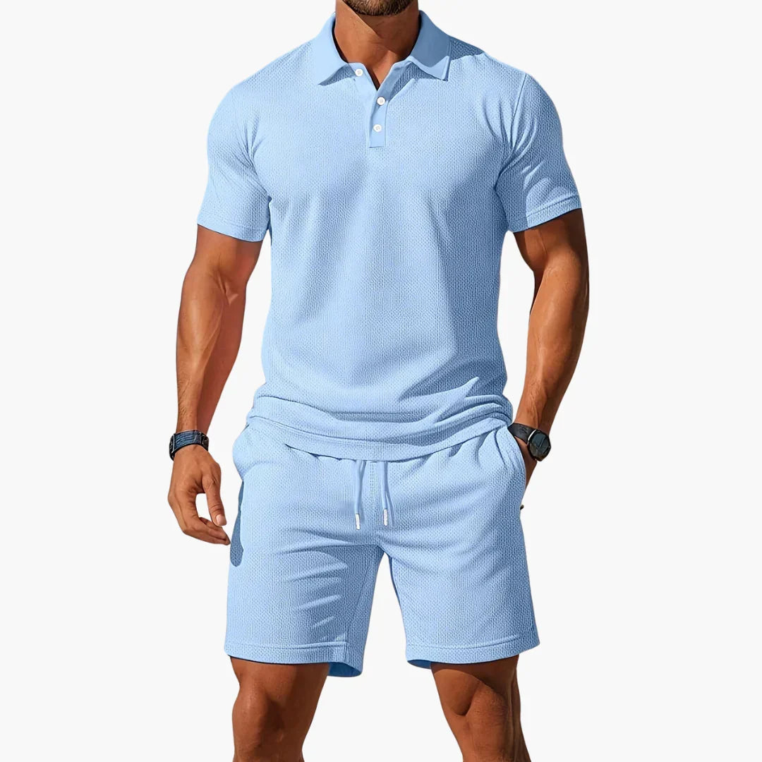 Men's classic summer polo and shorts set in blue, grey, orange and black tones, shown for menswear styling