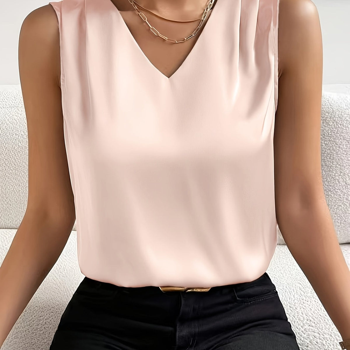 Women's sleeveless draped V-neck blouse in a refined solid colourway