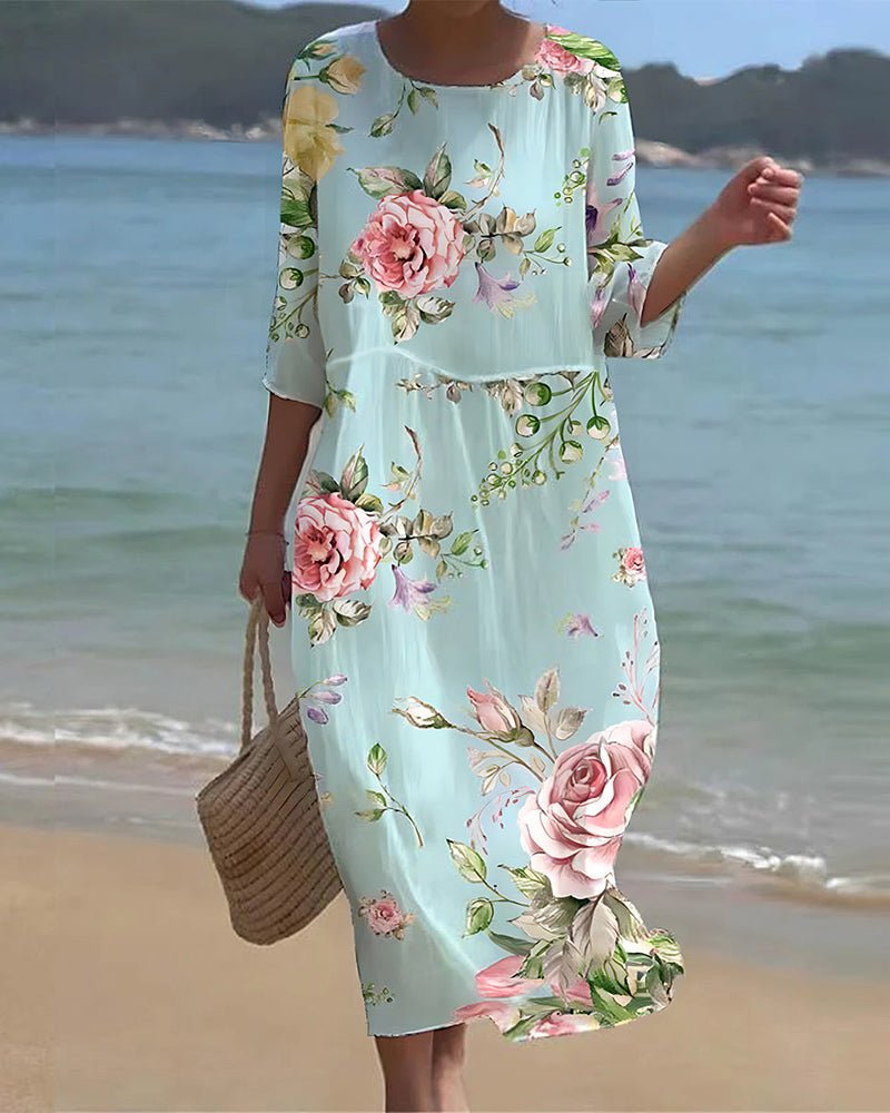 Women's sunset floral print dress in blue flower and green splash colorways