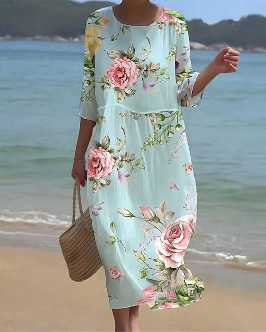 Women's sunset floral print dress in blue flower and green splash colorways