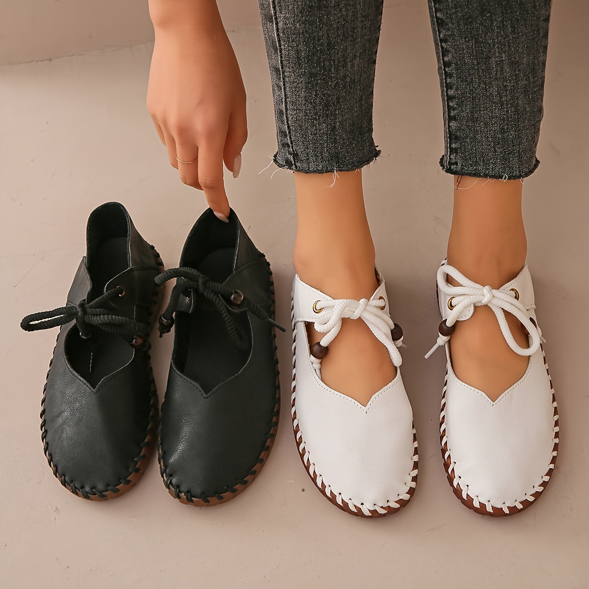 Kessoro Women's handcrafted cushioned lace-up flats in white and black, view 2