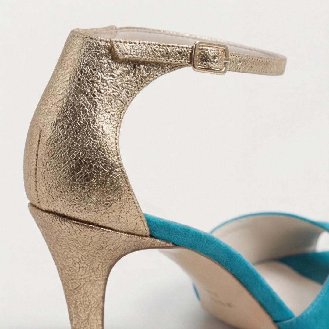 Women's teal suede strap heels with gold accents