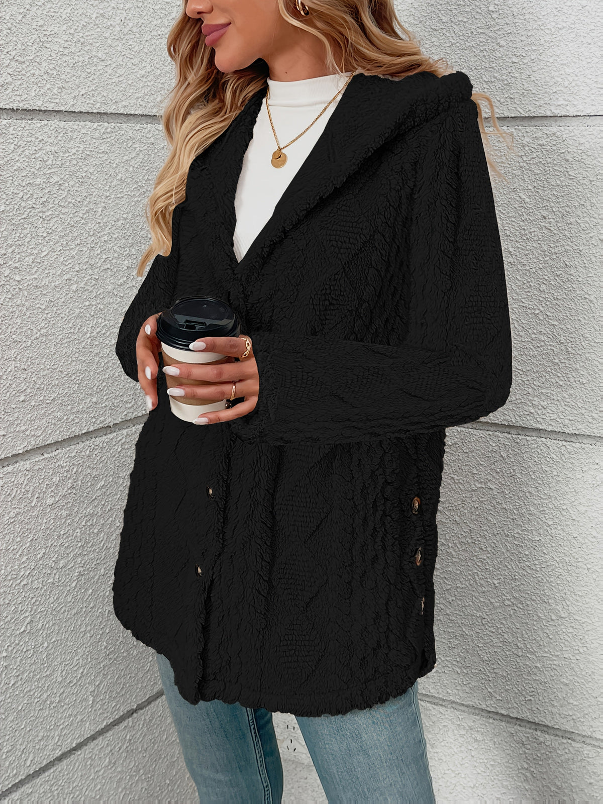 Women's textured plush button-front coat in black, styled view