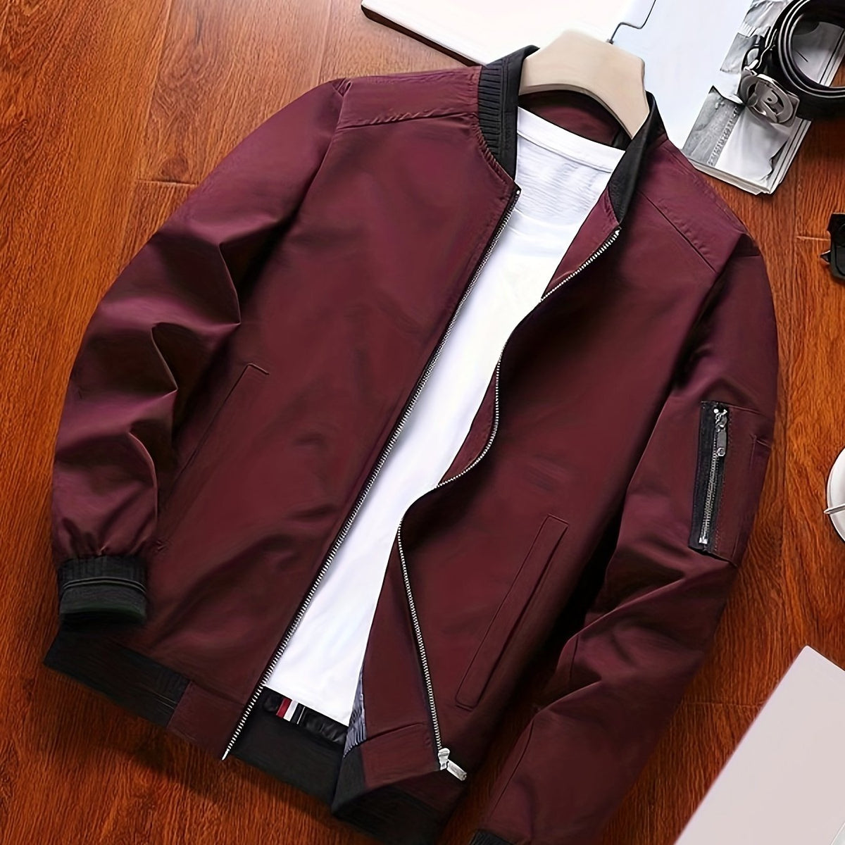 Men's classic zip-front everyday bomber jacket in black and burgundy, angled view