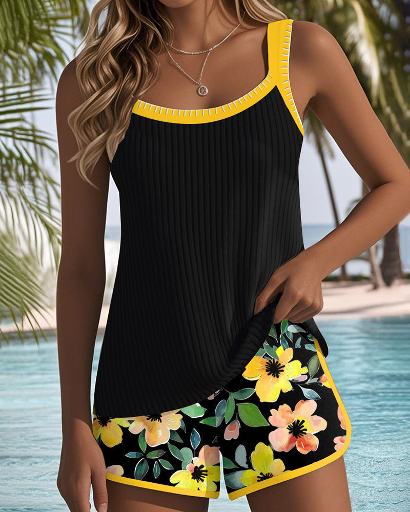 Kessoro Women's Two-Piece Tankini Top and Shorts Swim Set in orange, fuchsia, yellow and cyan/blue — close-up of the collar and trim