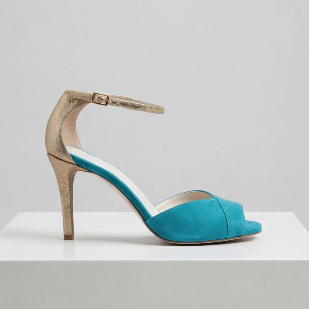 Women's teal suede strap heels with gold accents