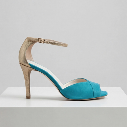 Women's teal suede strap heels with gold accents