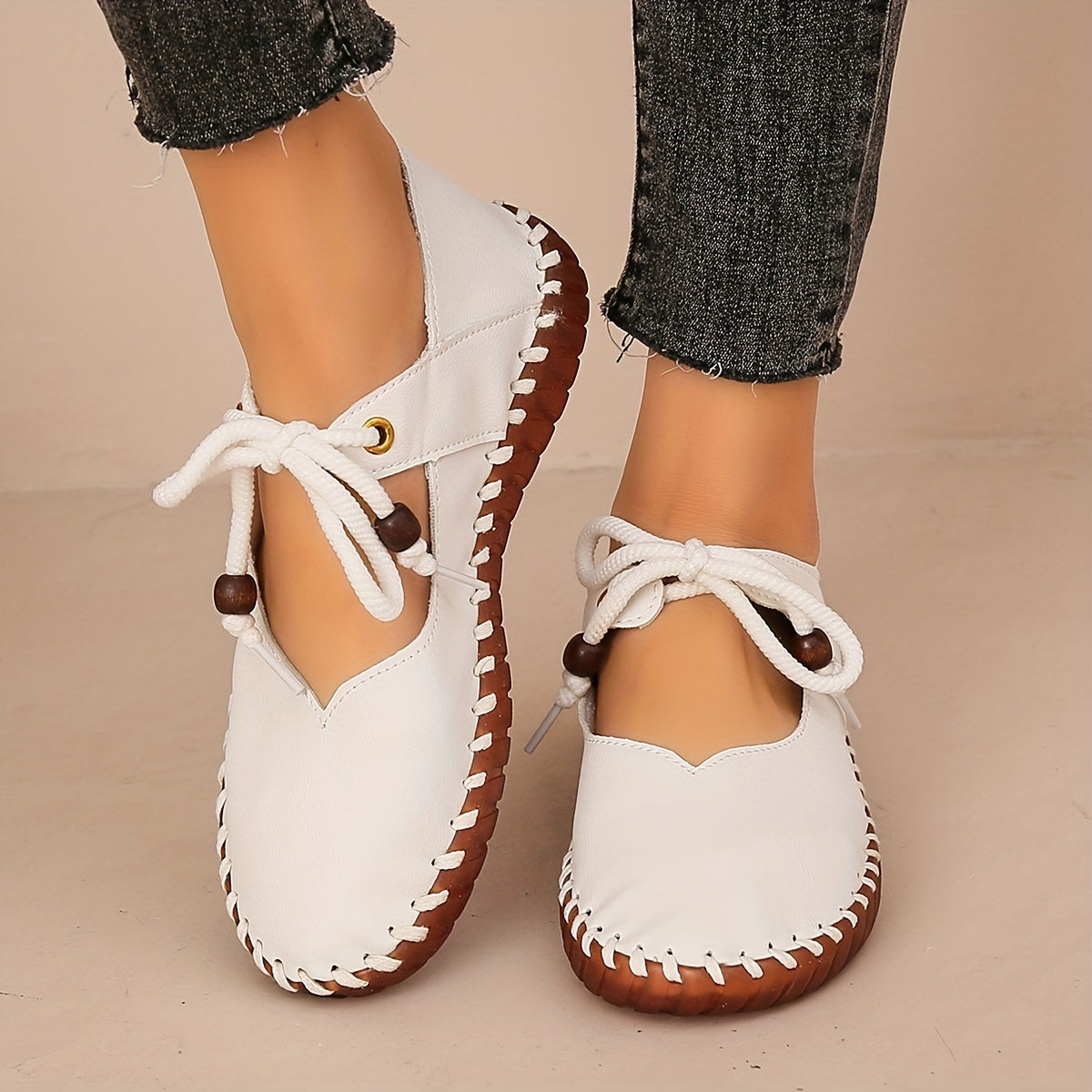 Kessoro Women's handcrafted cushioned lace-up flats in white and black, view 8