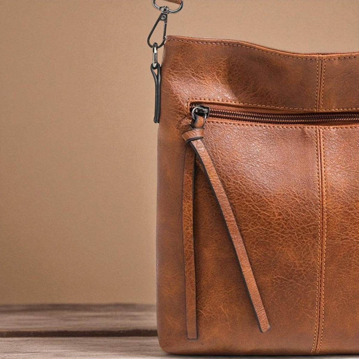 Kessoro women's casual zipper vegan leather sling bag in brown