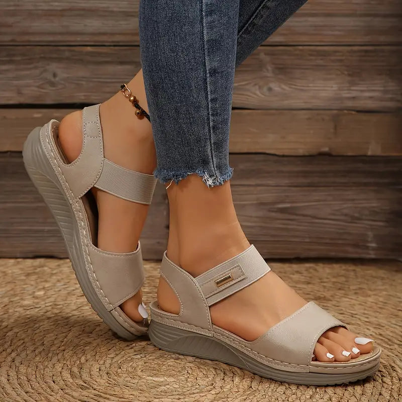 Women's cushioned open toe sandal in brown, black and beige with a supportive sole