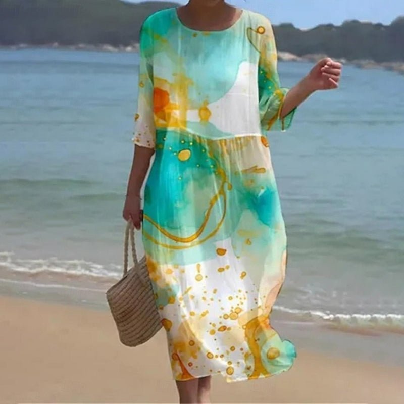 Women's sunset floral print dress in blue flower and green splash colorways