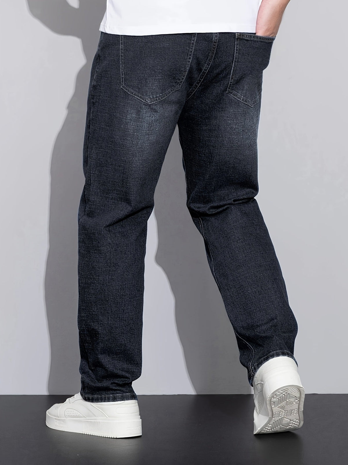 Men's mid-rise straight-leg stretch jeans in blue and black denim, colour option 2 front view