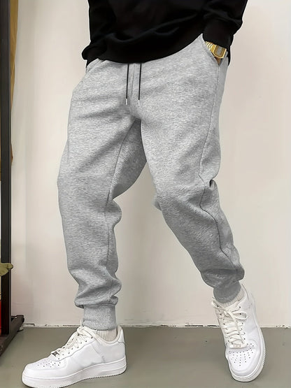 Kessoro unisex relaxed tapered drawstring joggers in black or grey with side pockets