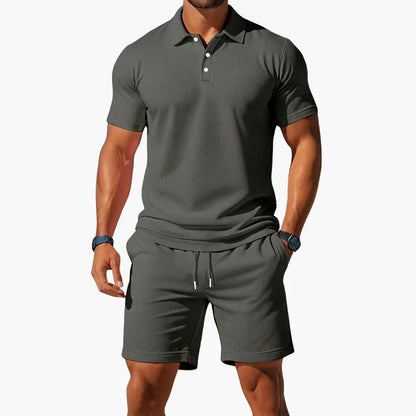 Men's summer polo and shorts two-piece set in blue, grey, orange and black tones, shown for menswear styling