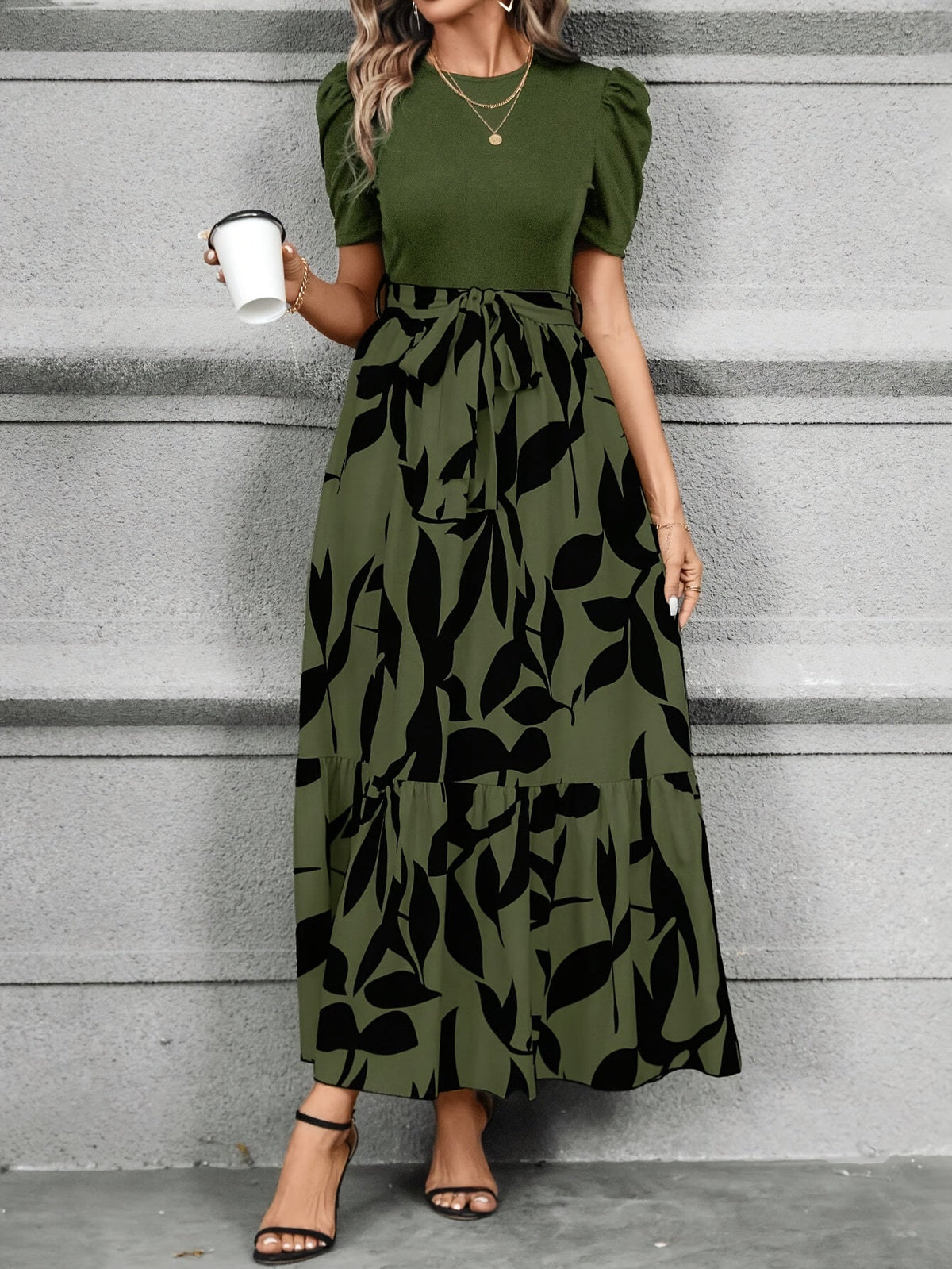 Kessoro women's printed tiered maxi dress shown in a green and black colourway on a female model