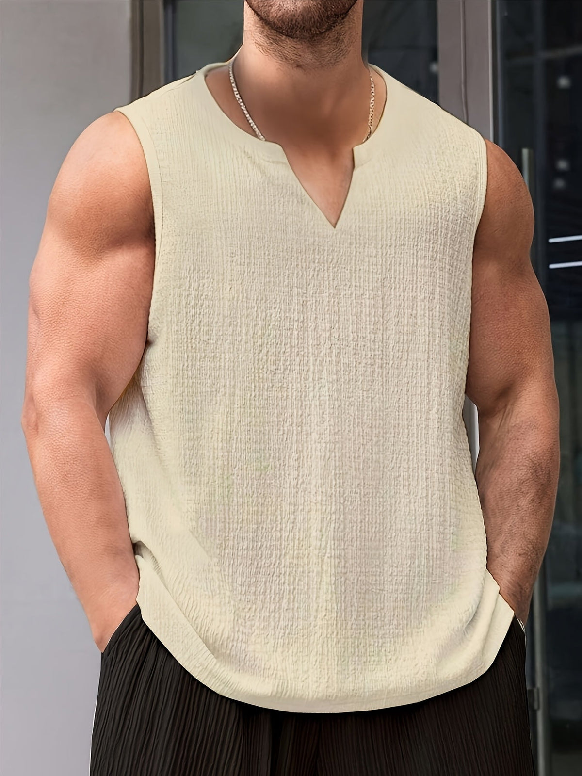 Kessoro men's relaxed notch-neck sleeveless tank top in apricot, black and white