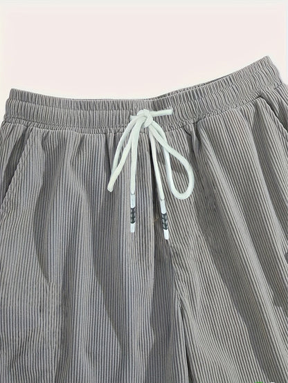 Men's textured drawstring cargo shorts in black, apricot and grey, view 7