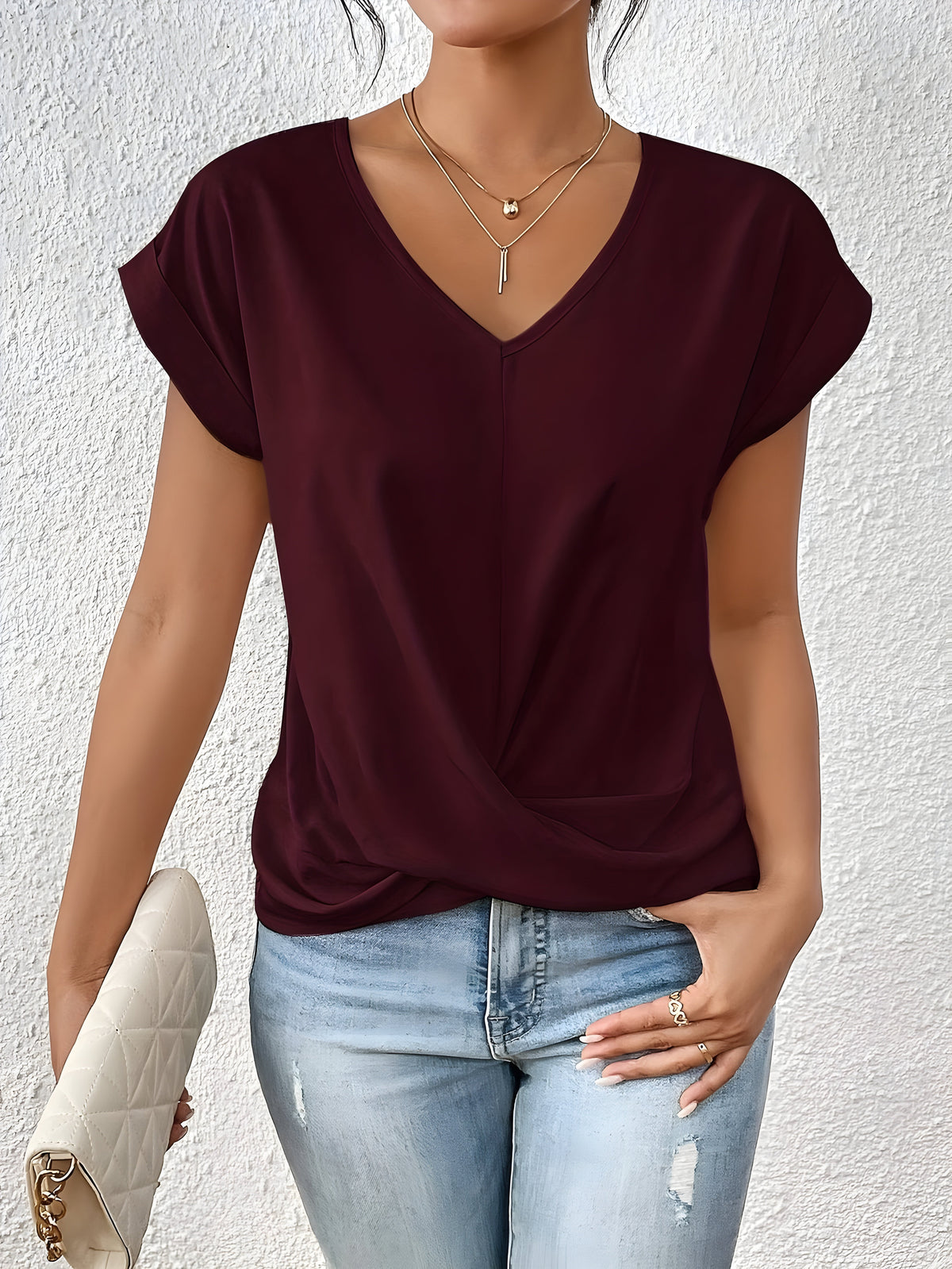 Women's twist-front V-neck top with waist-defining detail