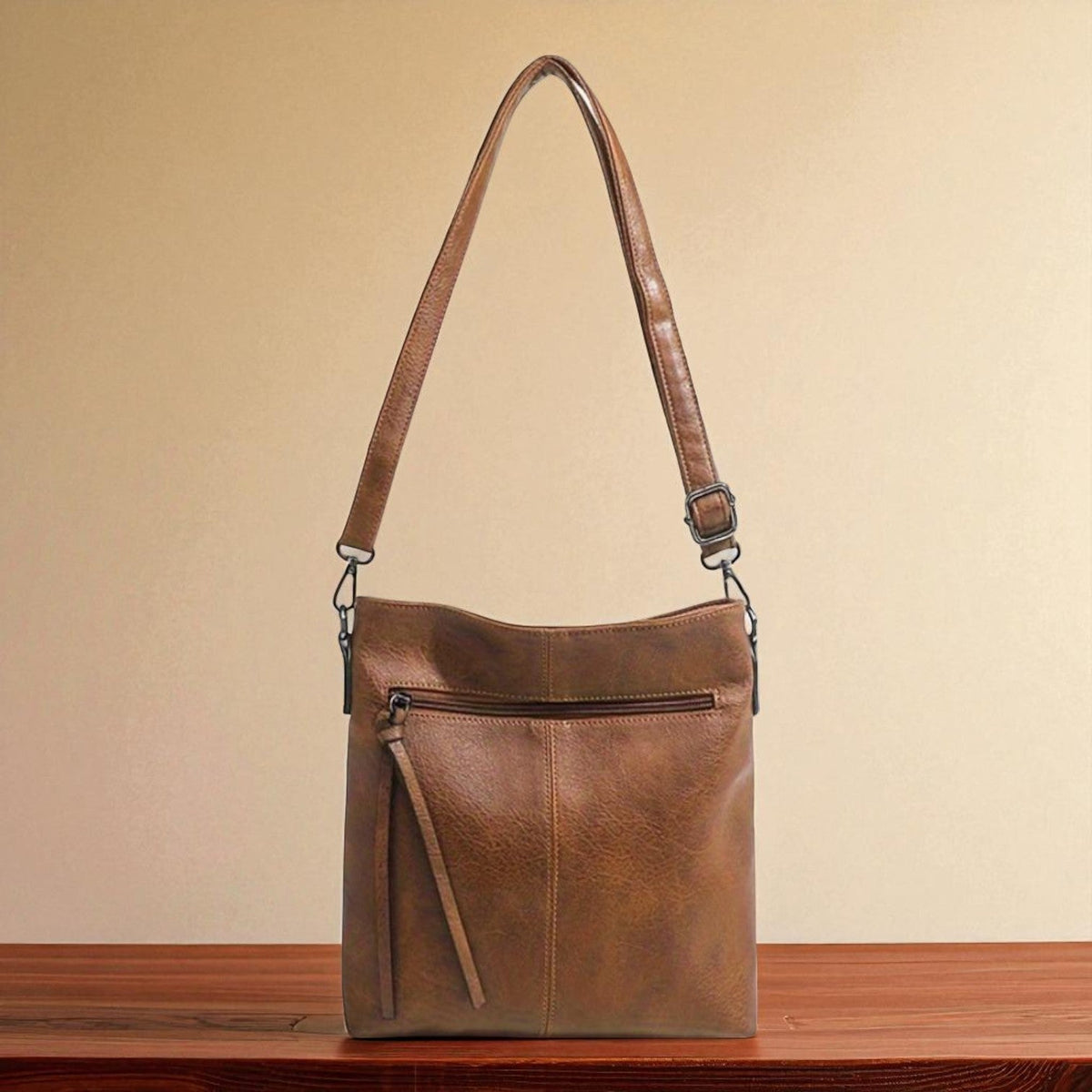 Kessoro women's casual zipper vegan leather sling bag in brown