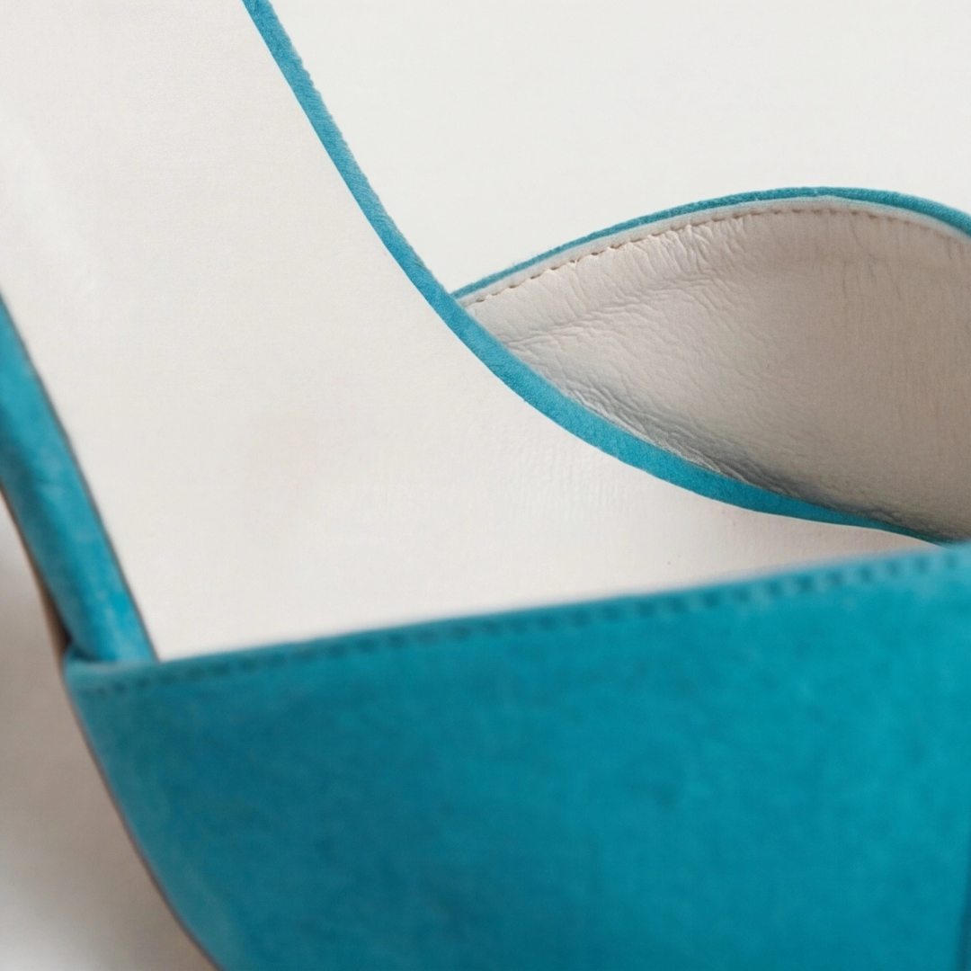 Women's teal suede strap heels with gold accents