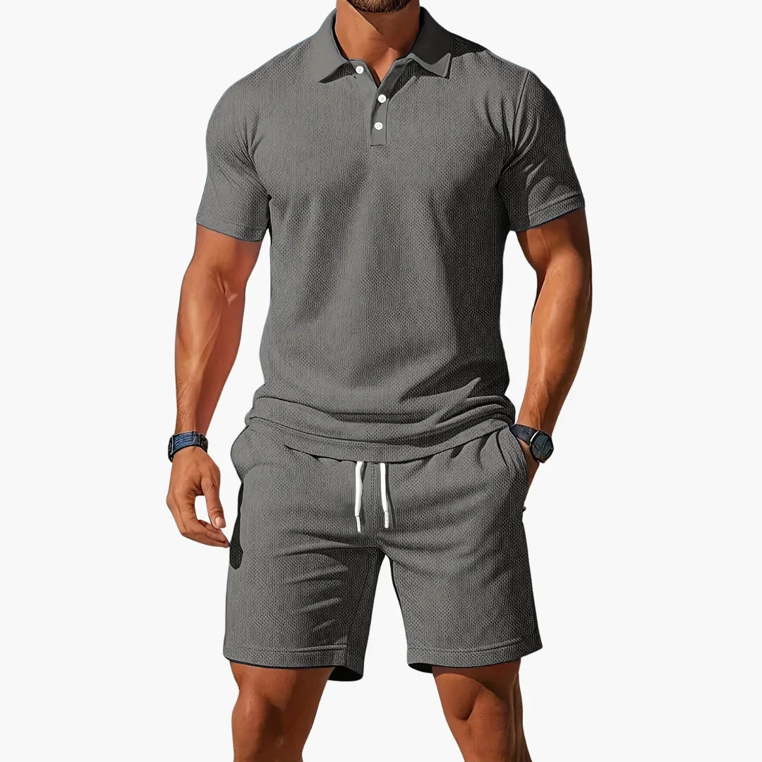 Men's classic summer polo and shorts set in blue, grey, orange and black tones, shown for menswear styling