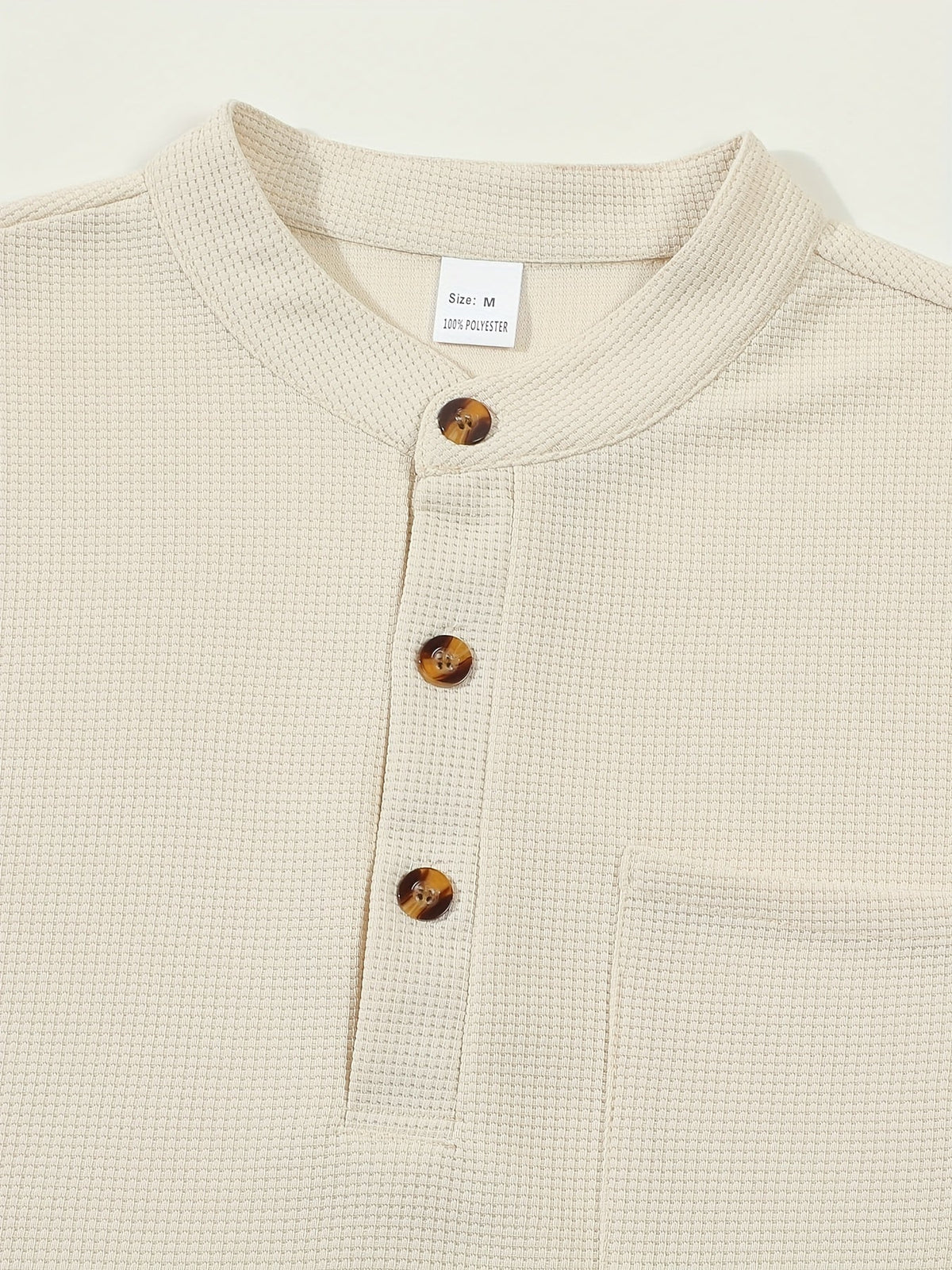 Men's textured long sleeve henley shirt in khaki, white, black, grey and burgundy, detail view