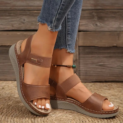 Women's cushioned open toe sandal in brown, black and beige with a supportive sole