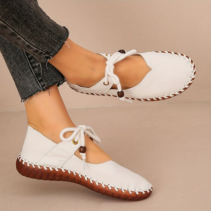 Kessoro Women's handcrafted cushioned lace-up flats in white and black, view 9