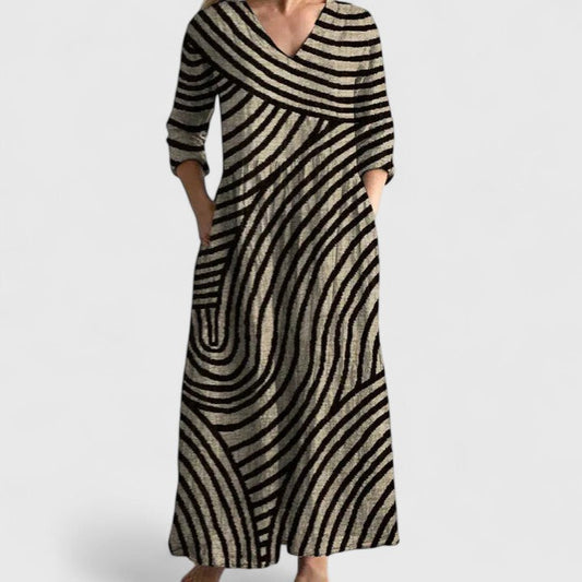 Women's relaxed V-neck dress in a gold and black geometric print with side pockets