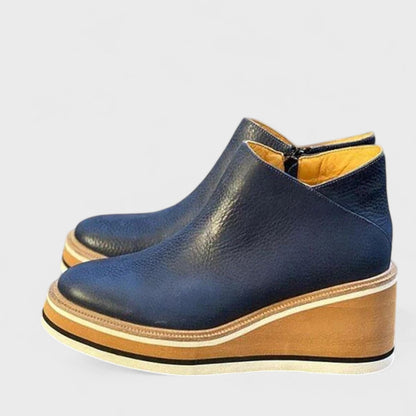 Women's waterproof side-zip ankle boots with a sleek silhouette