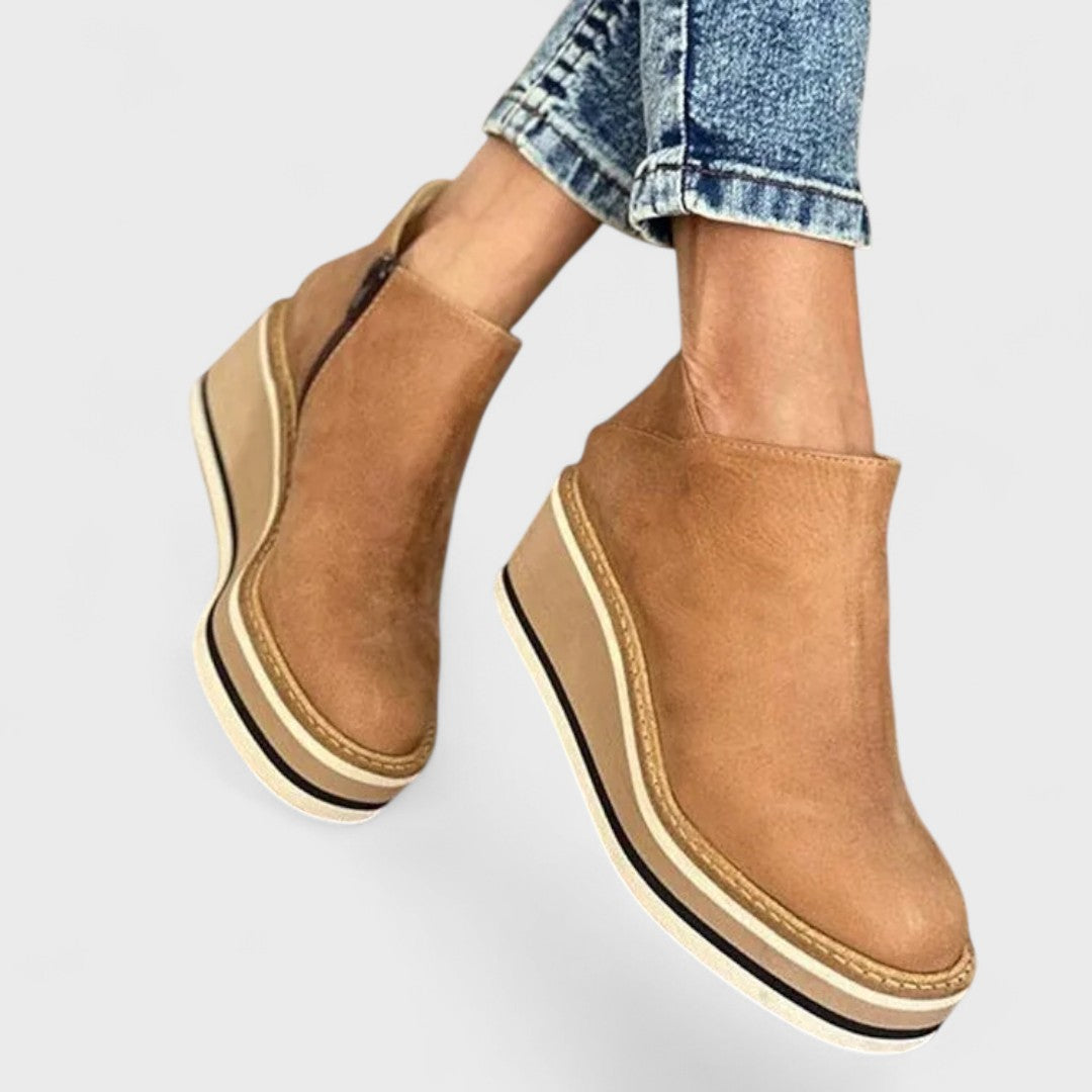 Women's waterproof side-zip ankle boots with a sleek silhouette