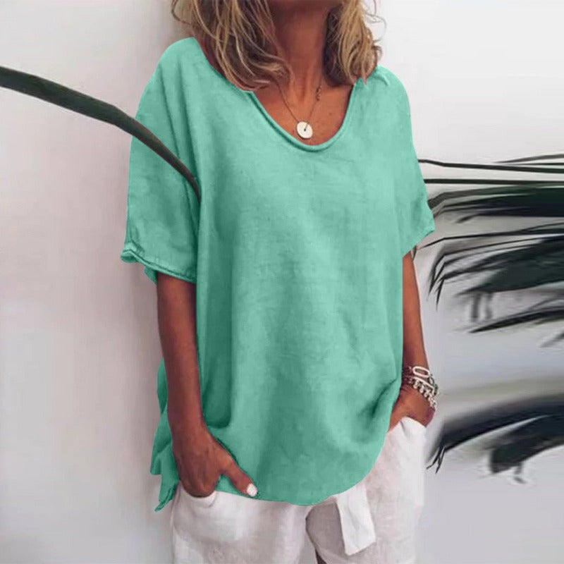 Women's draped V-neck short sleeve blouse in grey, white, pink, sea blue and green, shown for womenswear styling
