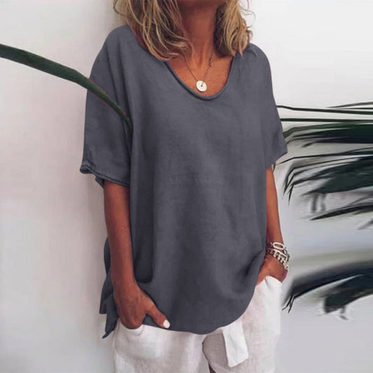 Women's draped V-neck short sleeve blouse in grey, white, pink, sea blue and green, shown for womenswear styling