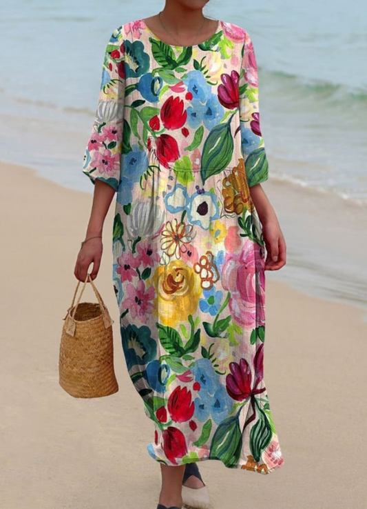 Women's floral print knee length dress with a round neck and short sleeves in blue and pink