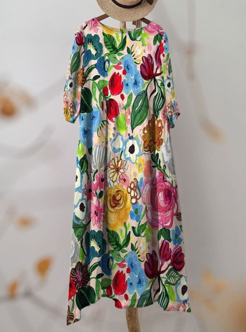 Women's floral print knee length dress with a round neck and short sleeves in blue and pink