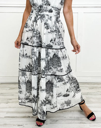 Women's toile print tiered maxi dress with a smocked waist and soft V-neckline