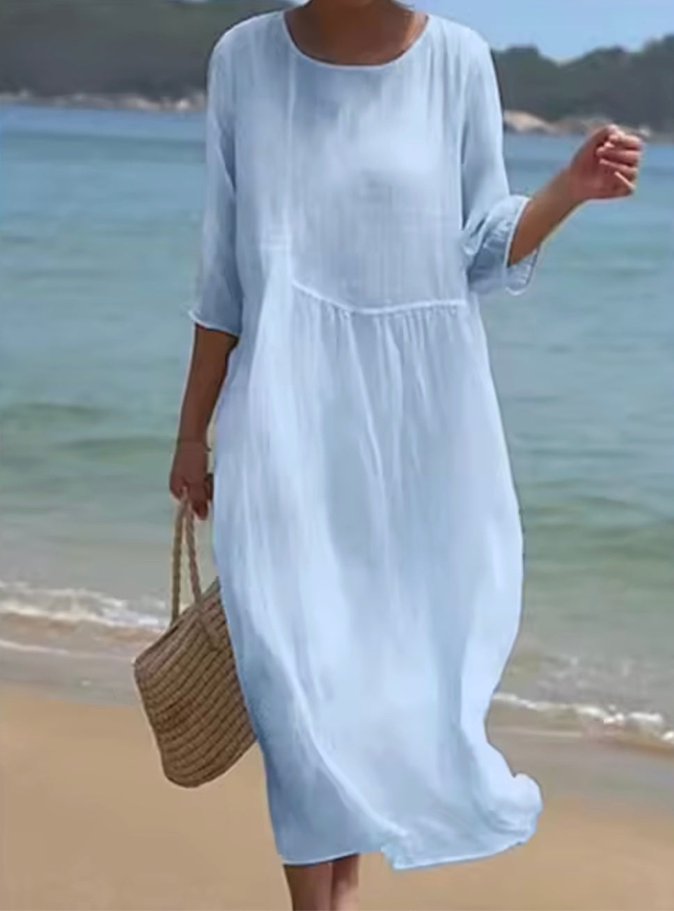 Women's floral print knee length dress with a round neck and short sleeves in blue and pink