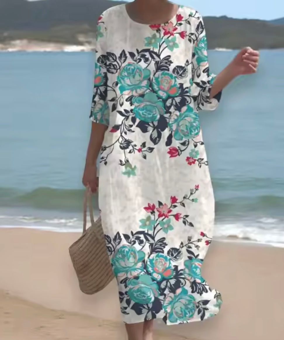 Women's floral print knee length dress with a round neck and short sleeves in blue and pink