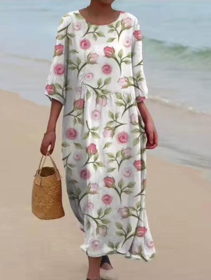 Women's floral print knee length dress with a round neck and short sleeves in blue and pink