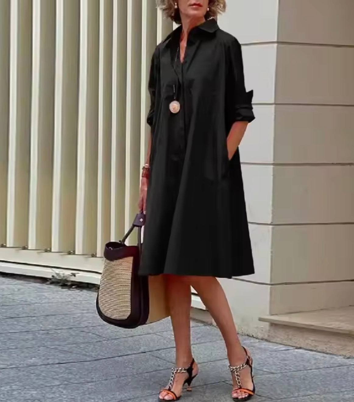 Women's collared A-line shirt dress with three-quarter sleeves and side pockets