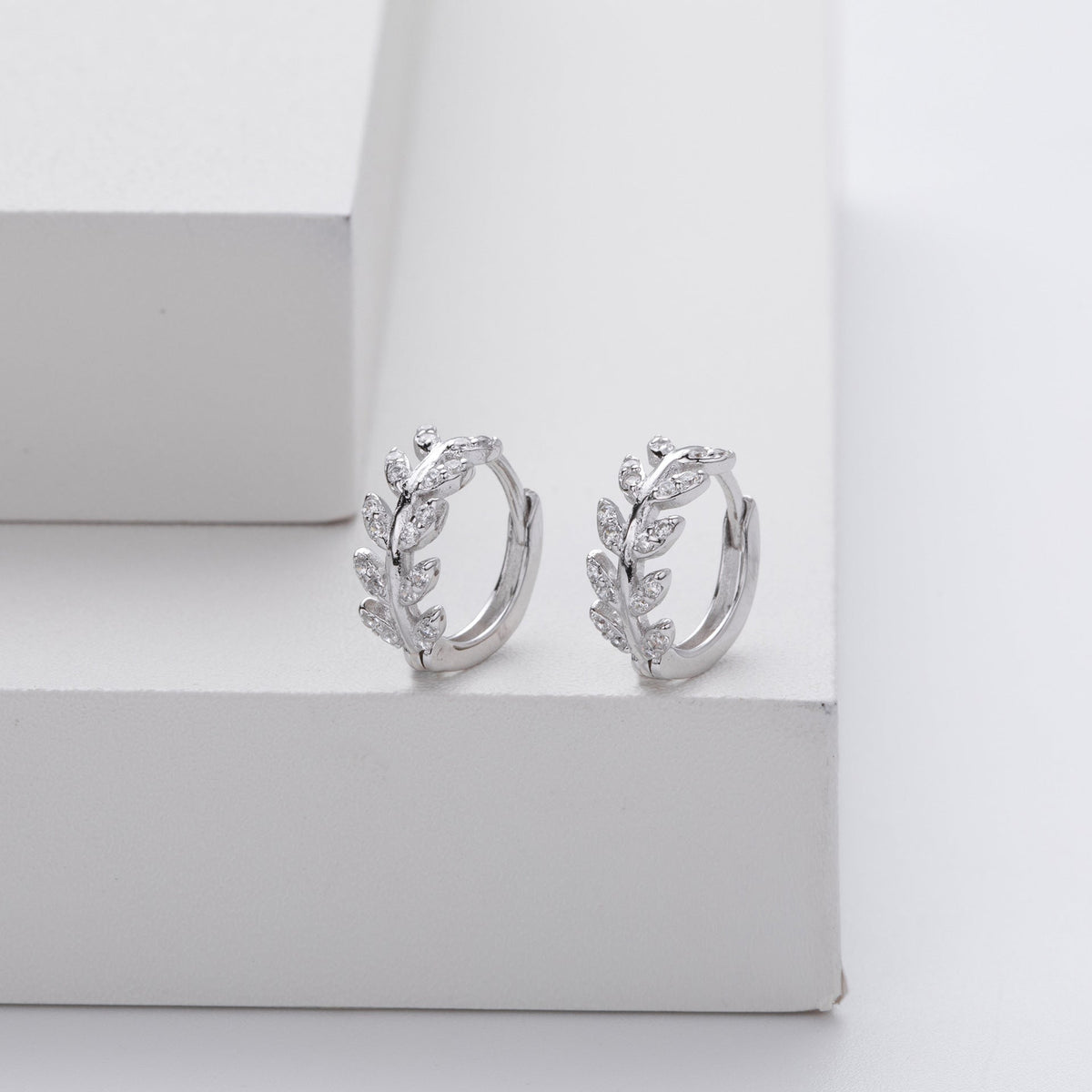 Kessoro women's two tone silver and gold leaf earrings shown in silver and gold finishes