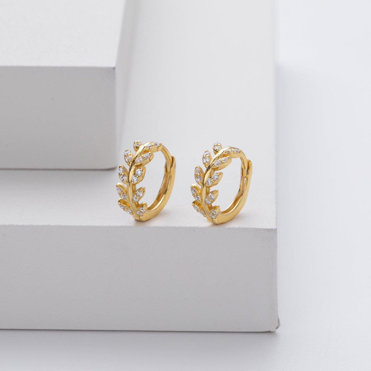 Kessoro women's two tone silver and gold leaf earrings shown in silver and gold finishes