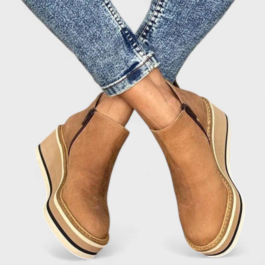 Women's waterproof side-zip ankle boots with a sleek silhouette